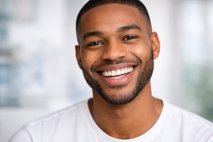Invisalign vs Veneers comparison for a confident smile makeover